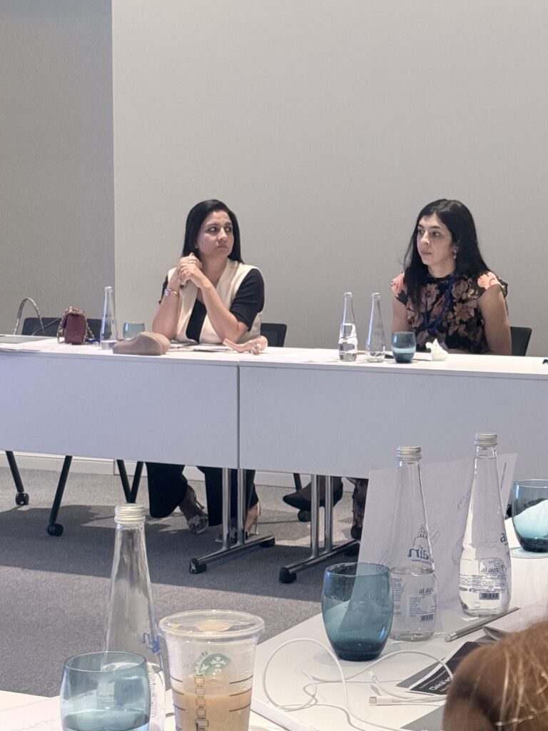 Two women seated together during the course.